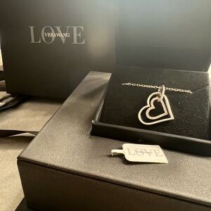 Vera Wang Love Collection 1/8 CT. T.W.
Diamond Tilted Double Heart Pendant